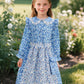 Vintage Floral Prairie Dress with Apron and Bonnet for Girls — A Charming Colonial-Era Ensemble